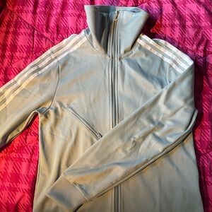 Pretty baby blue Adidas tracksuit jacket. Size small.